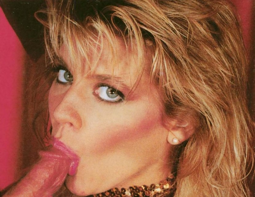 ginger lynn eyefucking the camera as a she sucks the tip of a dick